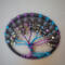 top view tree showing off blue and purple twisted branches adornd with glass beads